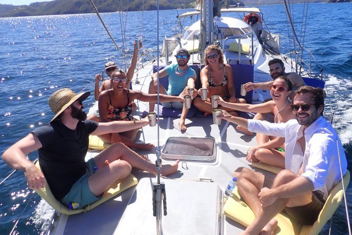a group of people on a boat in the water