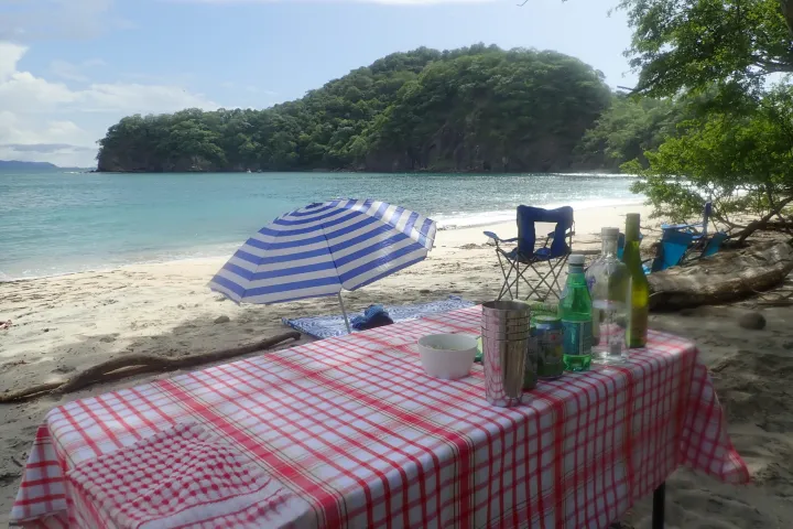 a group of lawn chairs sitting on top of a beach