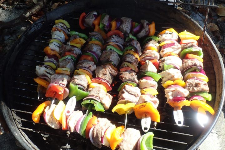 a pan of food on a grill