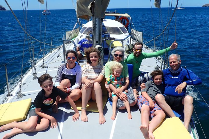 a group of people in a boat on a body of water