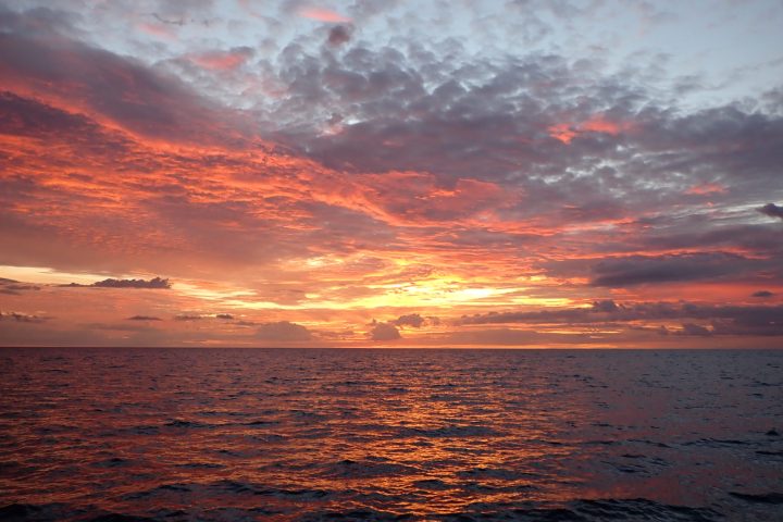 a sunset over a body of water