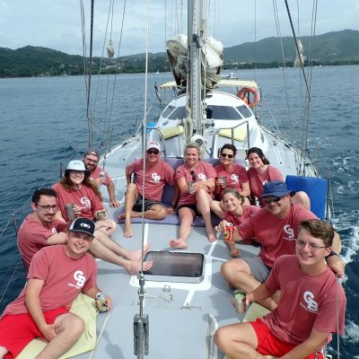 a group of people in a boat on a body of water
