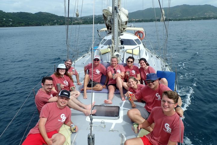a group of people in a boat on a body of water