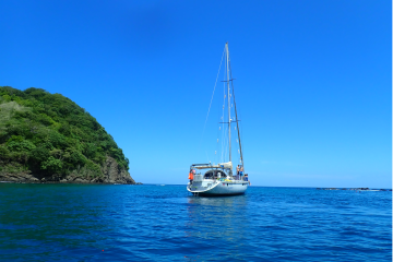 a small boat in a large body of water