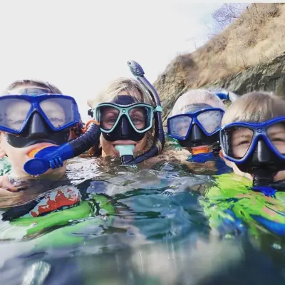 a group of people swimming in the water