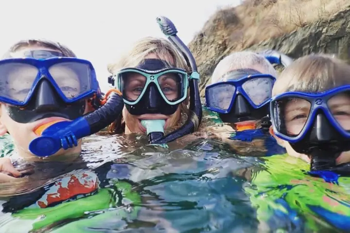 a group of people swimming in the water