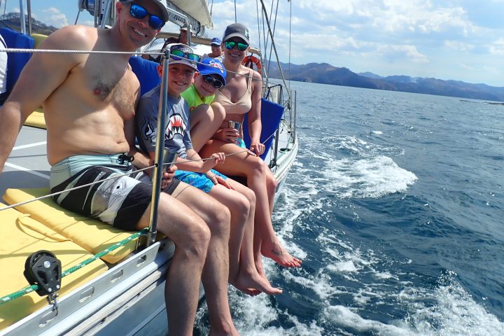 a person riding a surf board on a body of water
