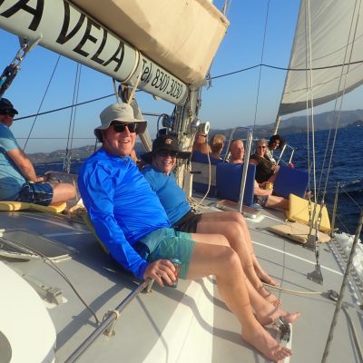 a man and a woman sitting on a boat