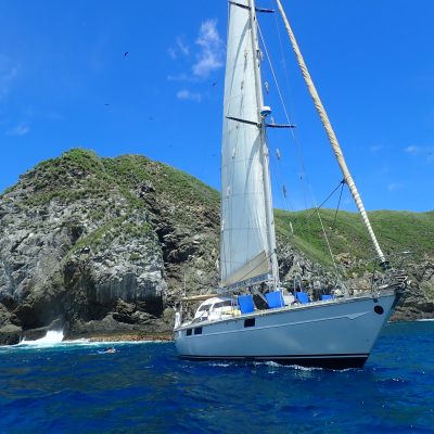 a blue and white boat in the water