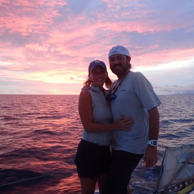 a person standing next to a body of water