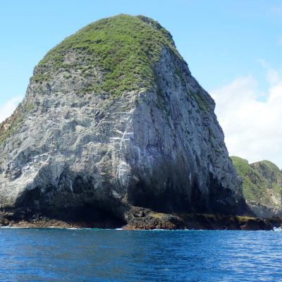 a body of water with a mountain in the background