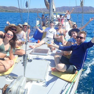 a group of people in a boat on a body of water