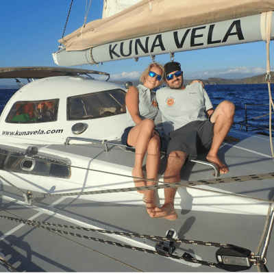 a man riding on the back of a boat next to a plane