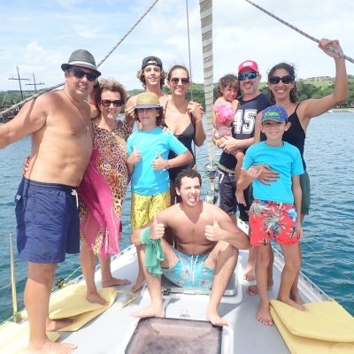 a group of people on a boat in the water