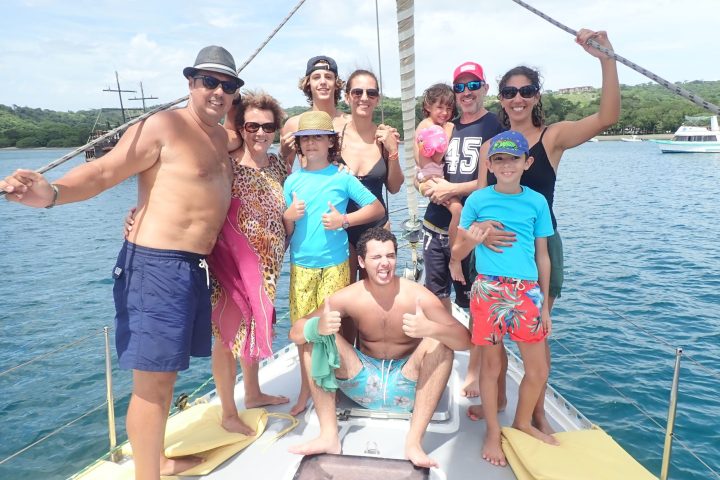 a group of people on a boat in the water