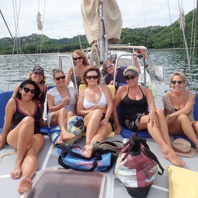 a group of people on a boat in the water