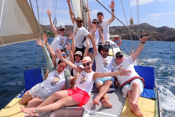 a group of people riding on the back of a boat