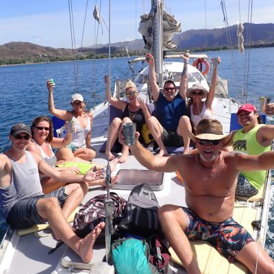 a group of people in a boat on a body of water