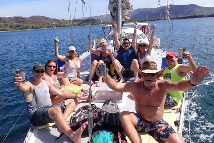a group of people in a boat on a body of water