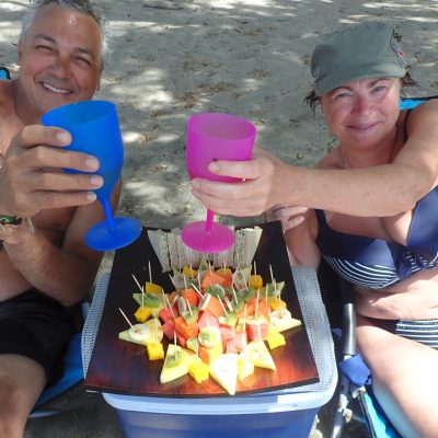 a group of people sitting at a beach