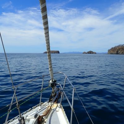 a boat is docked next to a body of water