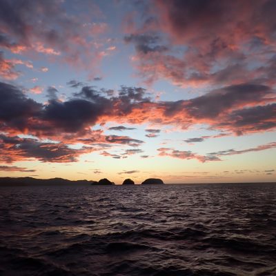 a sunset over a body of water