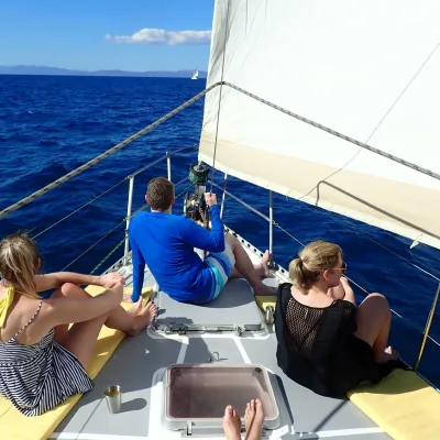 a group of people in a boat on a body of water
